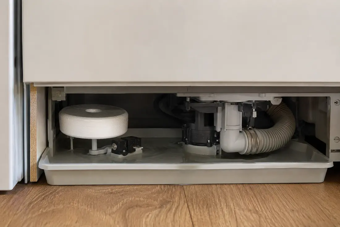 Dishwasher base tray flood float and drain pump
