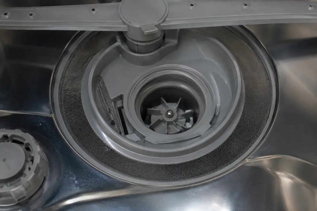 Dishwasher drain pump impeller inside the sump