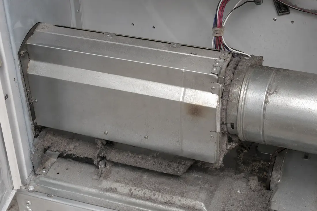 Lint buildup around the heater housing and dryer exhaust duct
