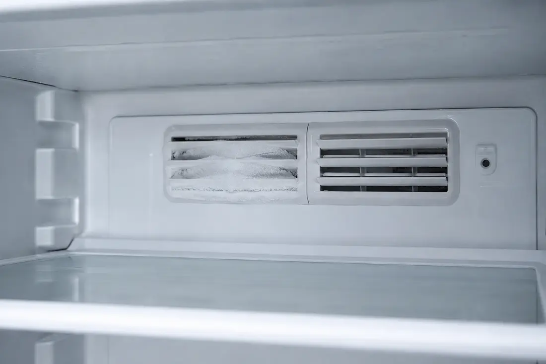 Refrigerator air damper vent partially blocked by frost