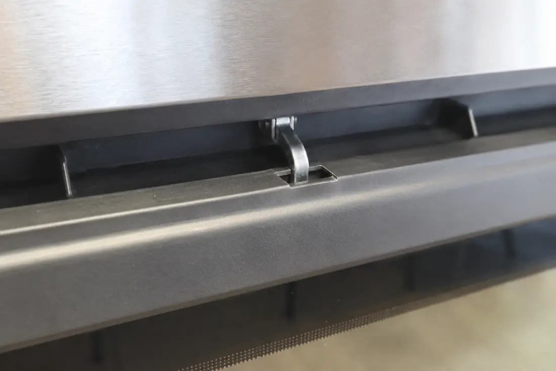 Oven self-clean door lock latch engaged in its keeper slot