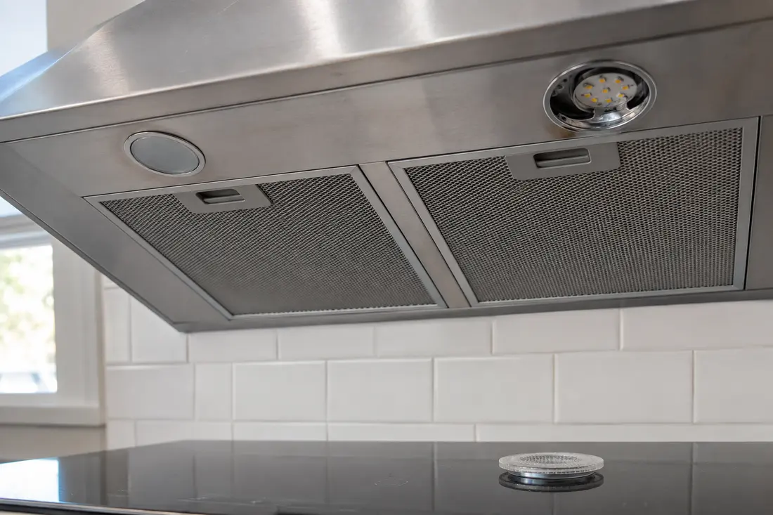 Unlit LED modules on the underside of a stainless range hood
